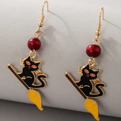 Black cat on a broom halloween dangle earrings
